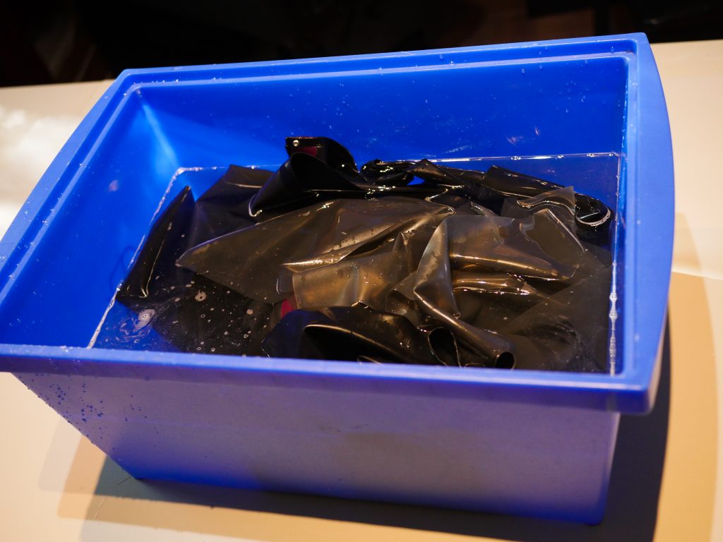 Latex care: Washing in a plastic container